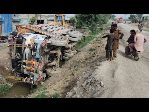 UNBELIEVABLE RECOVERY! 🏗️ Massive Dump Truck Rescued from Deep Canal after Brake Failure!